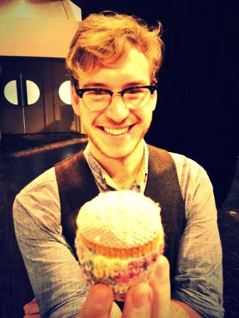 Bake Off 2012 finallist James Morton with a fan's knitted cupcake